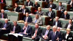 FILE - Malcolm Turnbull, bottom right, makes an address at Parliament after he was sworn in as prime minister in Canberra, Australia, Sept. 15, 2015. 