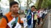 Participants hold hands at a demonstration in Hanoi opposing a plan to cut down around a quarter of the city's trees, March 22, 2105. 