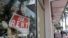 FILE - In this July 13, 2020 file photo, a For Rent sign hangs on a closed shop during the coronavirus pandemic in Miami Beach, Fla.
