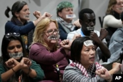 Activists participate in a demonstration for climate finance at the COP29 U.N. Climate Summit on Nov. 23, 2024, in Baku, Azerbaijan.