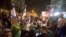 Israeli protesters hold flags and chant slogans during a demonstration against the cease-fire between Israel and Gaza's Hamas in Tel Aviv, Israel, Thursday, Nov. 15, 2018.