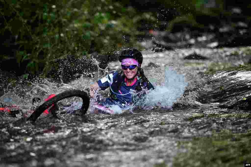 A woman competes in the mountain bike race as part of the &quot;Raid des Alizes&quot;, an all-female multi-sport competition on the French Caribbean island of Martinique.