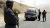 Afghan police officers search a vehicle at a checkpoint on the Ghazni highway, in Maidan Shar, west of Kabul, Afghanistan, Aug. 13, 2018. 