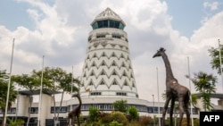 FILE - The control tower is seen at Zimbabwe's main international airport in Harare, Nov. 9, 2017. Earlier this week, authorities arrested five activists at the airport.