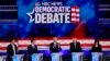 El candidato presidencial demócrata y exvicepresidente de EE.UU., Joe Biden, habla junto a otros candidatos durante el primer debate demócrata organizado por NBC News en el centro Adrienne Arsht para las Artes Escénicas, en Miami, Florida, el 27 de junio de 2019.