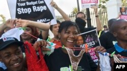 FILE - Protesters call for the South African government to act against rape and abuse of women in Cape Town on February 27, 2013. 