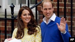 FILE - In this Saturday, May 2, 2015, file photo, Kate Duchess of Cambridge and Prince William smile as they carry their newborn baby Princess Charlotte from St. Mary's Hospital in London, following the birth.