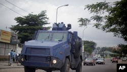 Congolese riot police in an armored vehicle drive the streets of Kinshasa, Democratic Republic of Congo, December 7, 2011.