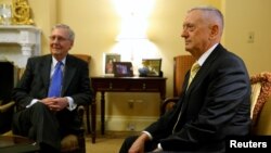  U.S. Senate Majority Leader Mitch McConnell, R-Ky., (left) welcomes retired U.S. Marine Corps General James Mattis, President-elect Donald Trump's nominee to be Defense Secretary, in his office at the Capitol in Washington, Dec. 7, 2016.