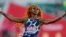 FILE - Sha'Carri Richardson celebrates after winning the fourth heat during the women's 100-meter run at Olympic trials, in Eugene, Oregon, June 18, 2021. Richardson has been disqualified from the Tokyo Olympics over the use of marijuana.