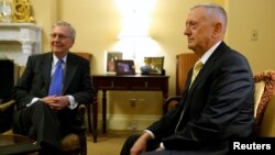 U.S. Senate Majority Leader Mitch McConnell, R-Ky., (left) welcomes retired U.S. Marine Corps General James Mattis, President-elect Donald Trump's nominee to be Defense Secretary, in his office at the Capitol in Washington, Dec. 7, 2016.