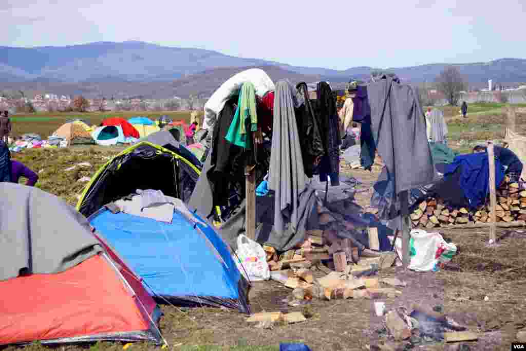 Some of the wood stocked near a tent in the camp, March 9, 2016. (J. Dettmer/VOA)