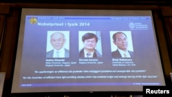 Japanese scientists Isamu Akasaki and Hiroshi Amano, and U.S. scientist Shuji Nakamura (L-R) are seen on a screen after being announced as the 2014 Nobel Physics Laureates at the Royal Swedish Academy of Science in Stockholm, October 7, 2014. Japan's Akas