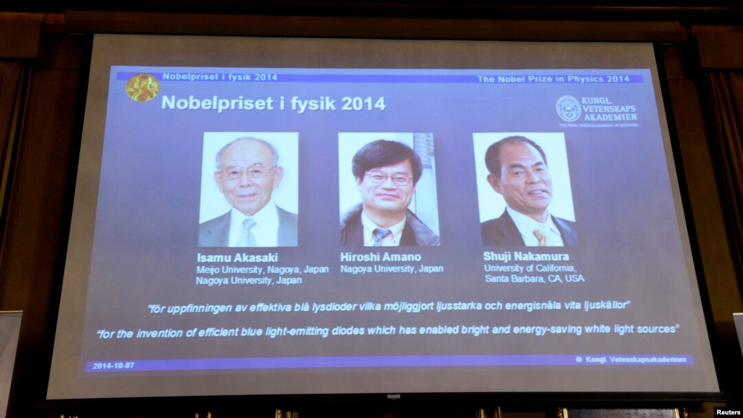 Japanese scientists Isamu Akasaki and Hiroshi Amano, and U.S. scientist Shuji Nakamura (L-R) are seen on a screen after being announced as the 2014 Nobel Physics Laureates at the Royal Swedish Academy of Science in Stockholm, October 7, 2014. Japan's Akas