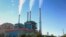 FILE - Smoke rises from the Colstrip Steam Electric Station, a coal-burning power plant in Colstrip, Mont., July 1, 2013. 