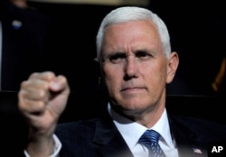 FILE - Mike Pence gestures on the second day of the 2016 Republican National Convention in Cleveland, Ohio, July 19, 2016.