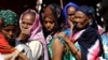 Ethiopian refugees who fled Tigray region, queue to receives treatment within the Fashaga camp on the Sudan-Ethiopia border, in Kassala state, Sudan, Dec. 14, 2020.