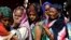 Ethiopian refugees who fled Tigray region, queue to receives treatment within the Fashaga camp on the Sudan-Ethiopia border, in Kassala state, Sudan, Dec. 14, 2020.