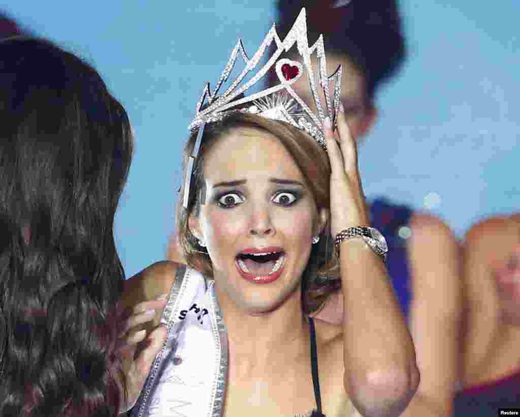 Miss Switzerland 2014 Laetitia Guarino reacts after she won the Miss Switzerland beauty pageant on the Federal Square in Bern, Oct. 11, 2014. 