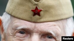 FILE - A World War II veteran looks on during a Victory Day celebration in Gorky Park in Moscow, May 9, 2012. 