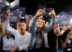 FILE - A group of young supporters cheer for Democratic presidential candidate Sen. Barack Obama, D-Ill. at a rally in Roanoke, Virginia, Oct. 17, 2008.