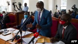 Merdad Segona, center, lawyer for former Ugandan presidential candidate Robert Kyagulanyi, aka Bobi Wine, speaks during a civil court hearing in Kampala, Jan. 21, 2021, to seek an end to house arrest for Kyagulanyi and his wife.