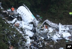 Rescue workers at the wreckage of an airplane that was carrying the Brazilian soccer club Chapecoense when it crashed outside Medellin, Colombia, Nov. 29, 2016.