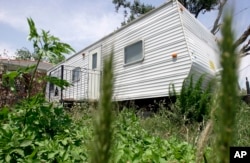 FILE - A Federal Emergency Management Agency trailer sits in front of home in the Lakeview area of New Orleans, Louisiana, May 7, 2008.