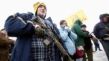 FILE - Chris Harris carries an AR-15 rifle at a pro-gun activist rally as part of the National Day of Resistance, at the state Capitol in Salt Lake City, Utah, February 23, 2013. (REUTERS/Jim Urquhart) 