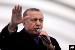 Turkey's President Recep Tayyip Erdogan gestures as he speaks during the opening ceremony of Eurasia Tunnel in Istanbul, Tuesday, Dec, 20, 2016. Erdogan said he and Russian President Vladimir Putin, with whom he spoke by phone Monday night, were "in agreement that this was an open provocation'', referring to the assassination of Russian ambassador to Turkey, Andrei Karlov, in Ankara Monday.
