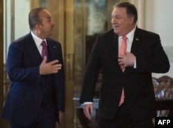 U.S. Secretary of State Mike Pompeo, right, meets with Turkish Foreign Minister Mevlut Cavusoglu at the U.S. Department of State in Washington, April 3, 2019.