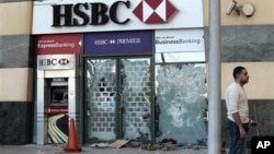 A HSBC bank branch remains damaged on the Arcadia shopping center, that was looted, damaged and set on fire by people in Cairo, Egypt, January 30, 2011.