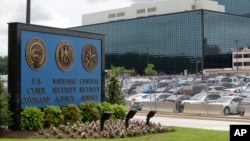 A sign for the National Security Agency and the U.S. Cyber Command is seen in Fort Meade, Maryland, June 6, 2013.