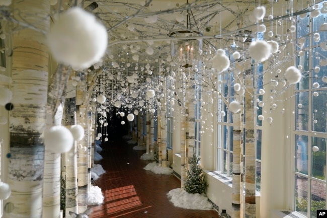 The East Colonnade of the White House is decorated for the holiday season during a press preview of holiday decorations at the White House, Monday, Nov. 28, 2022, in Washington. (AP Photo/Patrick Semansky)