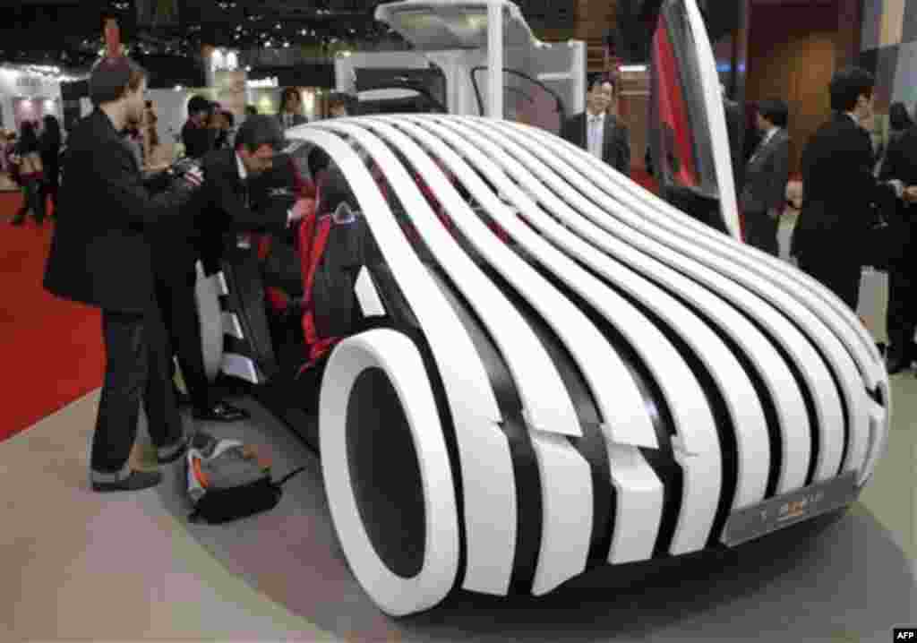 Toyota Boshoku Co.'s concept vehicle T-Brain is displayed at the Tokyo Motor Show in Tokyo, Japan, Wednesday, Nov. 30, 2011. (AP Photo/Itsuo Inouye)