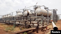 FILE - An oil processing facility is seen at an oilfield in Unity State, South Sudan, April 22, 2012.