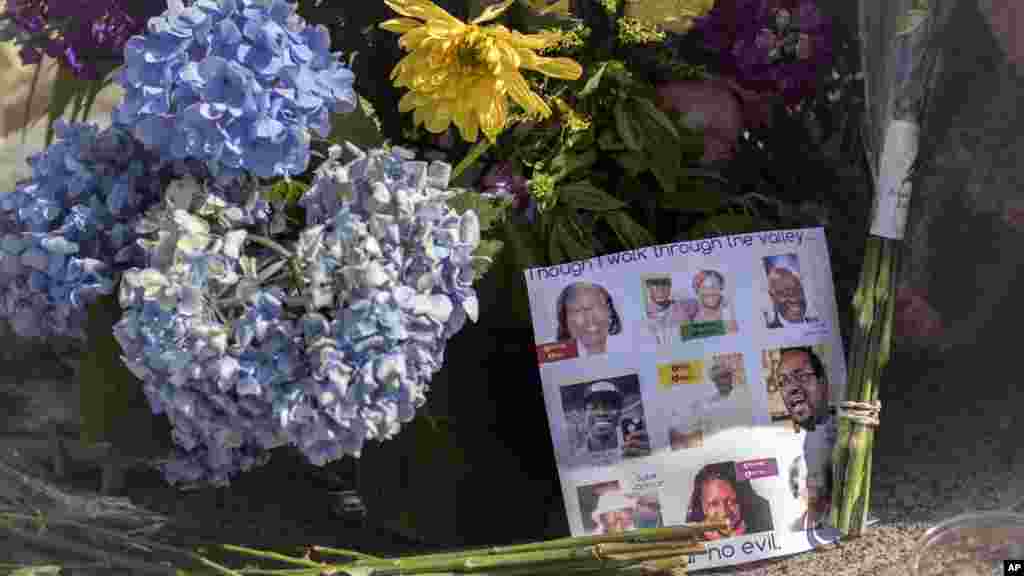 Flowers and notes of hope and support from the community line the sidewalk in front of the Emanuel AME Church in Charleston, S.C. , June 19, 2015. 