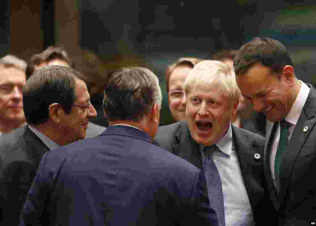 British Prime Minister Boris Johnson, second right, speaks with Irish Prime Minister Leo Varadkar, right, and Hungarian Prime Minister Viktor Orban, center, during a round table meeting at an EU summit in Brussels, Belgium. Britain and the European Union reached a new tentative Brexit deal, hoping to finally escape the acrimony, divisions and frustration of their three-year divorce battle.