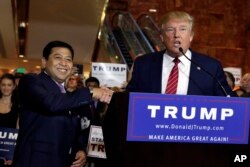 FILE - Then-Republican presidential candidate Donald Trump, right, introduces Setya Novanto, speaker of the House of Representatives of Indonesia, during after a news conference at Trump Tower in New York, Sept. 3, 2015.