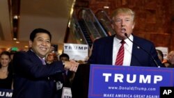 Republican presidential candidate Donald Trump, right, introduces Setya Novanto, speaker of the House of Representatives of Indonesia, during after a news conference at Trump Tower in New York, Sept. 3, 2015. 
