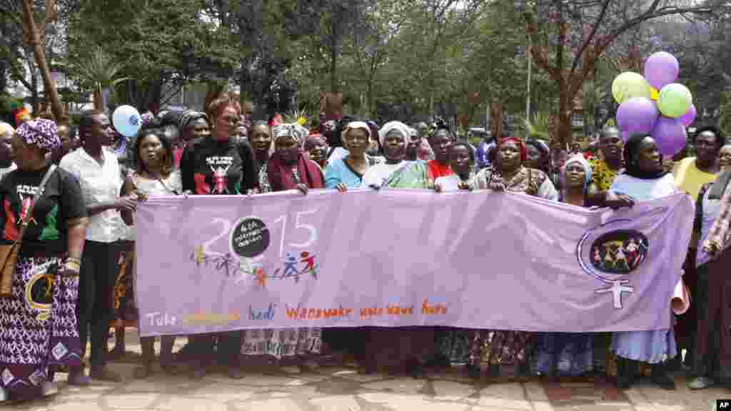 Women from Kenya, Uganda, Tanzania, Rwanda and Burundi participate in the world march of woman in Nairobi, Kenya