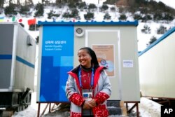 In this Feb. 12, 2018 photo, Sungsook Kim, a Catholic nun who goes by her religious name, Sister Droste, poses for a photograph outside her trailer office, the Gender Equality Support Center, at Phoenix Snow Park.