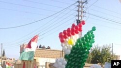 Demonstrators protesting against Syria's President Bashar al-Assad march through the streets on the first day of the Muslim festival of Eid-al-Adha in Alsnmin near Daraa, November 6, 2011.