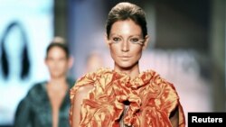 A model presents a creation by student designers during Colombiamoda fashion event in Medellin, Colombia, July 29, 2015. 