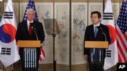 U.S. Vice President Mike Pence, left, speaks as South Korea's acting President and Prime Minister Hwang Kyo-ahn listens during a joint news conference after their meeting in Seoul, South Korea, Monday, April 17, 2017.