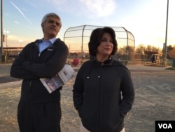 Danish Bashir's parents, Imran and Amina, watch a softball game in Springfield, Va. (C. Presutti/VOA)