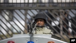FILE - A Pakistani paramilitary soldier guards a special court. 