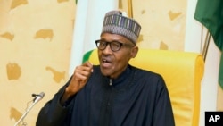 In this photo released by the Nigeria State House, Nigeria President Muhammadu Buhari speaks at the presidential palace upon his arrival from medical vacation in Abuja, Nigeria, March 10, 2017. 