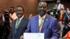 Orange Democratic Party presidential candidate, Raila Odinga (R), displays his registration certificate, with running mate Vice President Kalonzo Musyoka (L), in Nairobi, Kenya, Jan. 30. 2013.