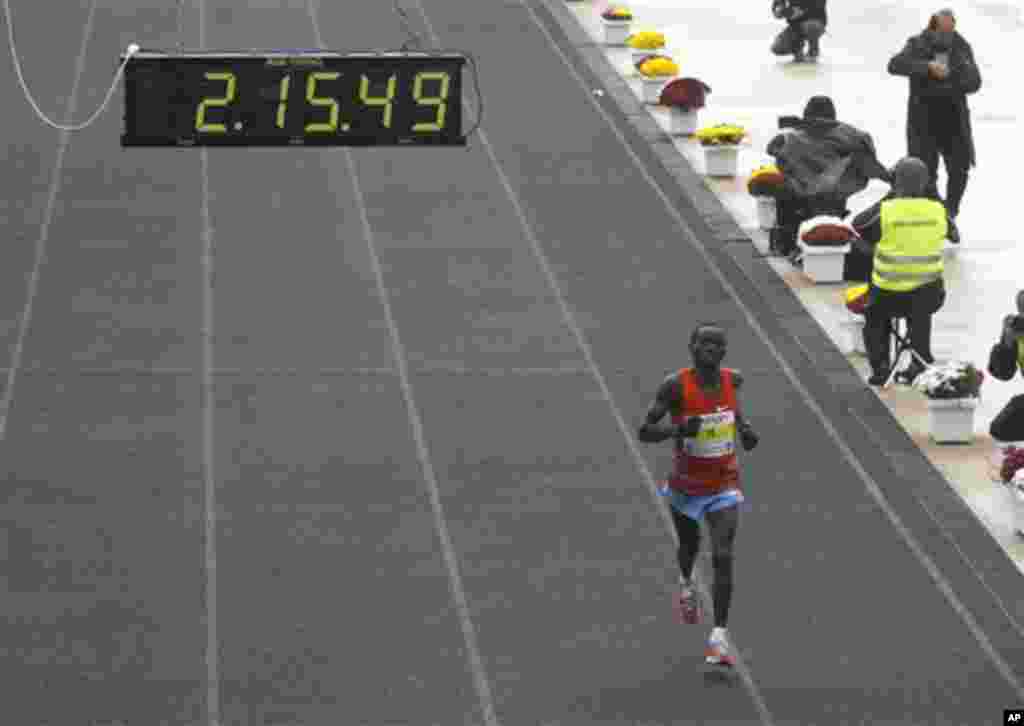 Daniel Ndiritu Gatheru of Kenya finishes third the Athens Classic Marathon at the Panathinaikon Stadium in Athens, on Sunday, Nov. 13, 2011. About 18,000 people took part in the marathon and two shorter races of 5 kms and 10 kms as the race was run in c